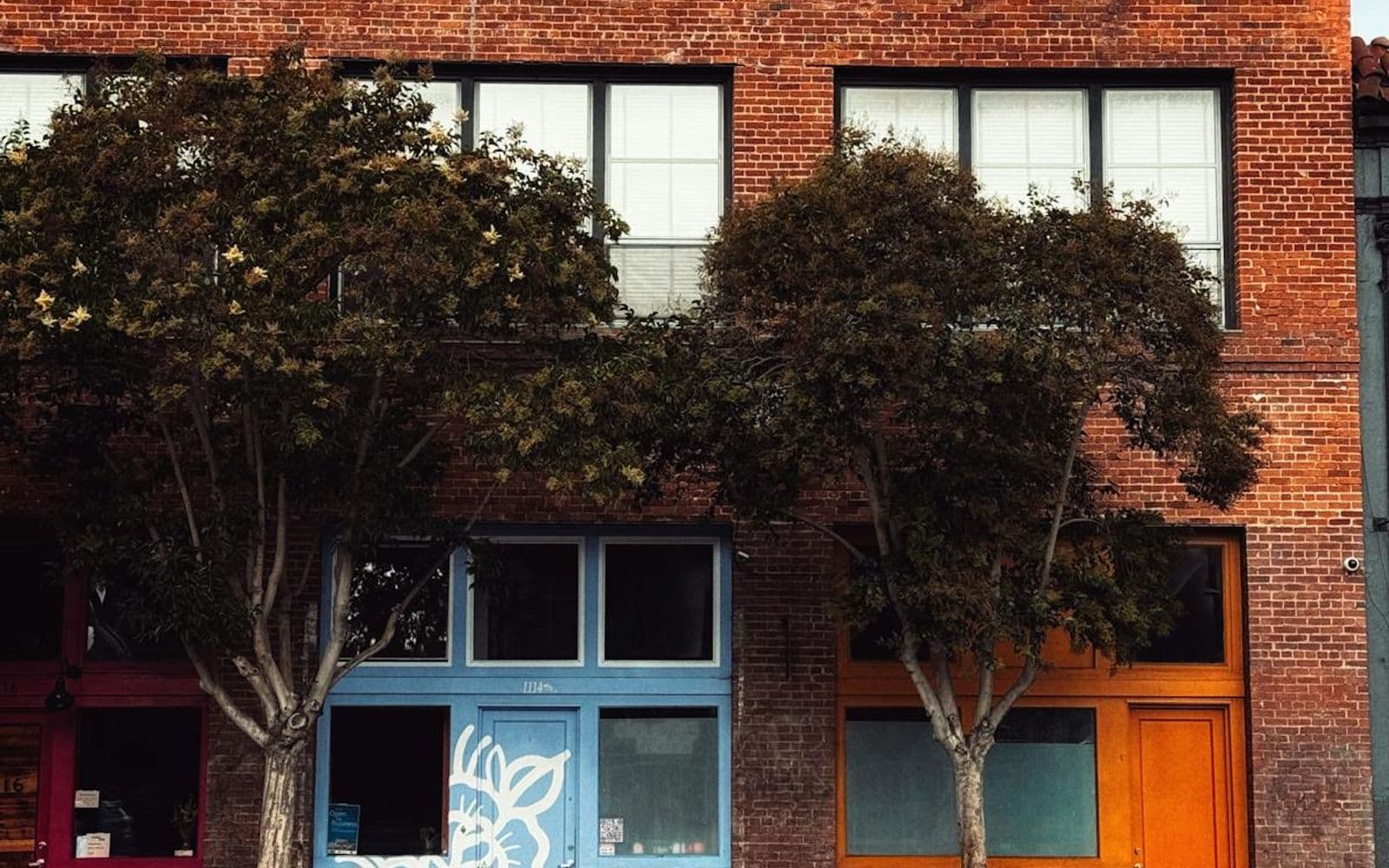 Brick building with vibrant storefronts