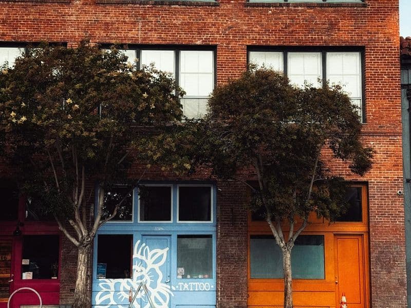 Brick building with vibrant storefronts